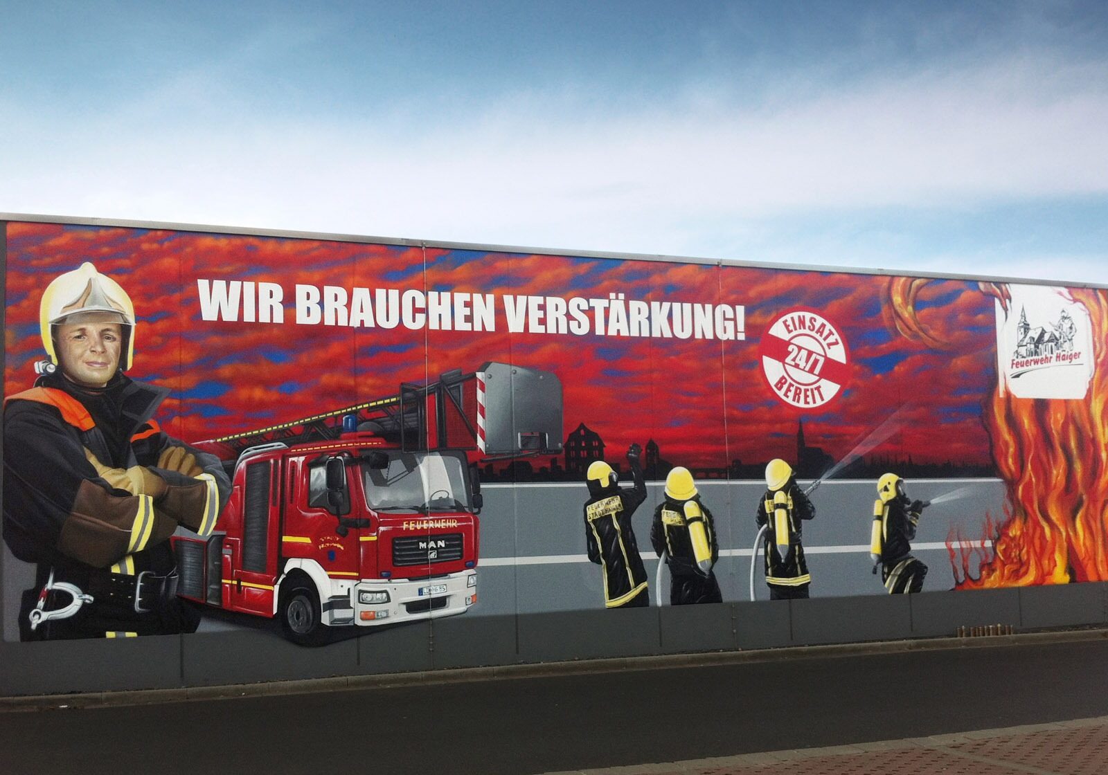 graffitikuenstler-graffitiauftrag-artmos4-feuerwehr-haiger-fotorealistisch-auto-menschen-logo