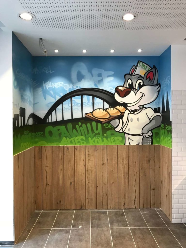 graffitiauftrag-graffitikuenstler-artmos4-Bäckerei Wolff_Wolf_Graffiti_Köln_2020_skyline_wolf_logo_landschaft_01