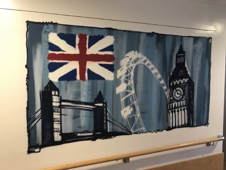 graffitiauftrag-graffitikuenstler-artmos4-rummelsberger-diakonie-weltkarte-laender-england-flagge-sehenswuerdigkeiten-innen-illustrativ-bunt