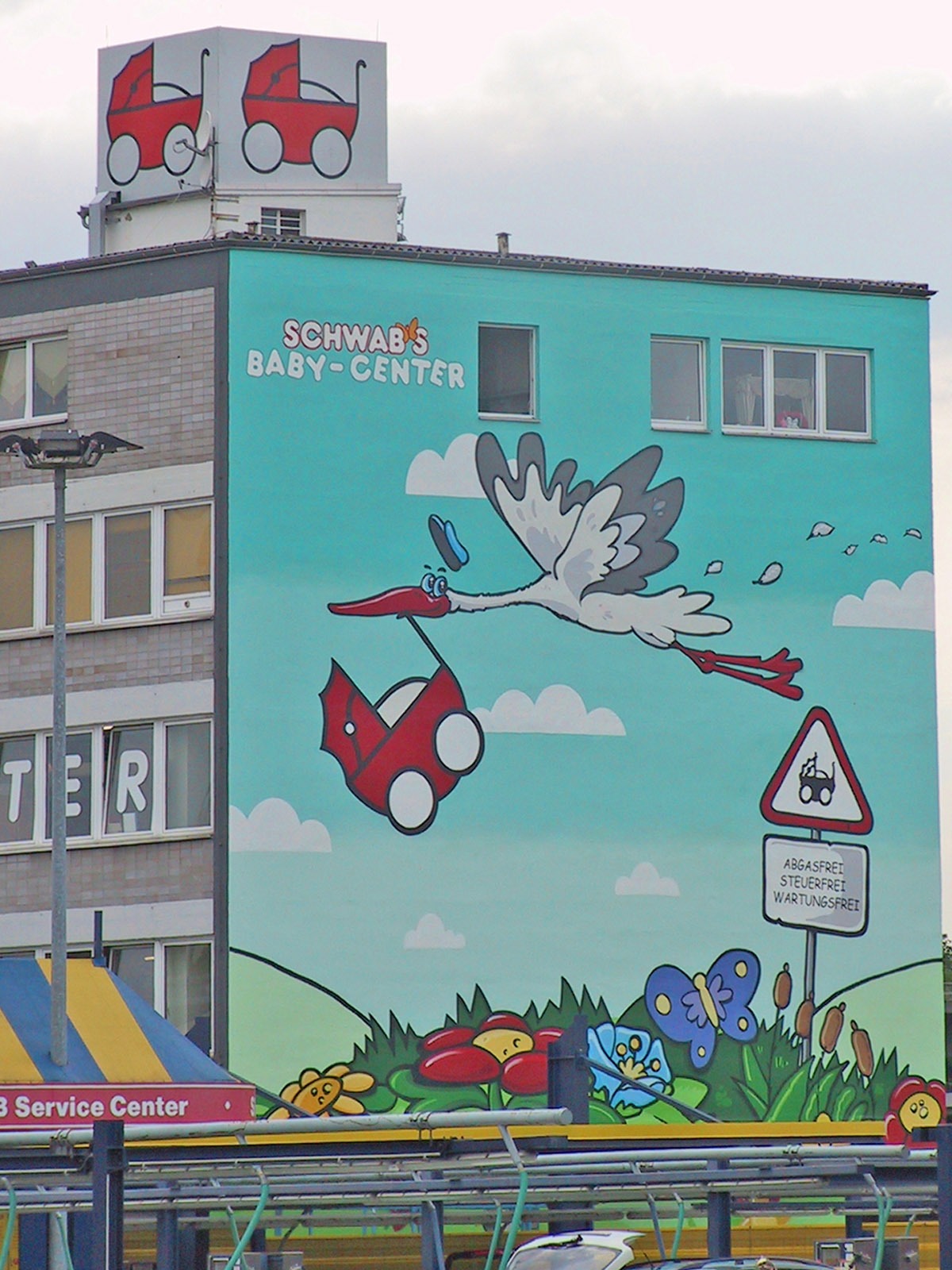 graffitiauftrag-graffitikuenstler-artmos4-schwabs-babycenter-comic-tiere-pflanzen